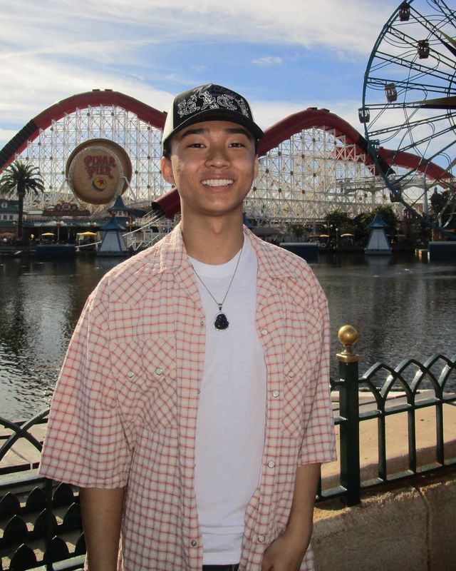 Gerald smiling at Pixar Pier