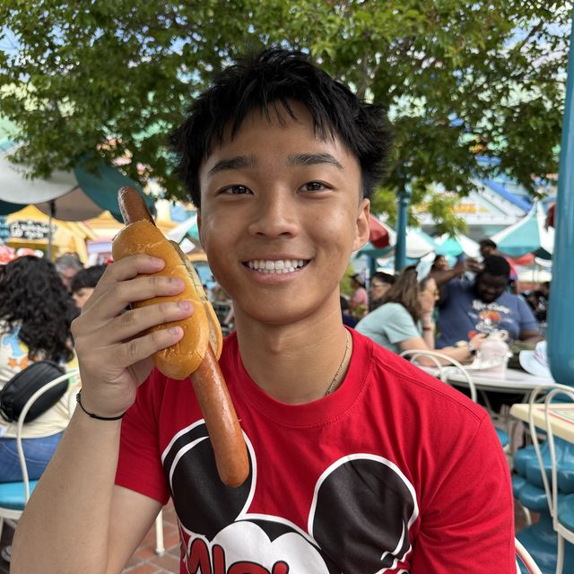 Gerald holding a giant hot dog